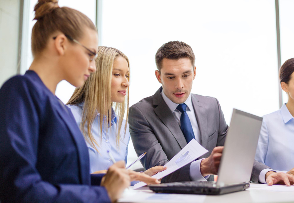 business-technology-office-concept-concentrated-business-team-with-laptop-computers-documents-having-discussion-office