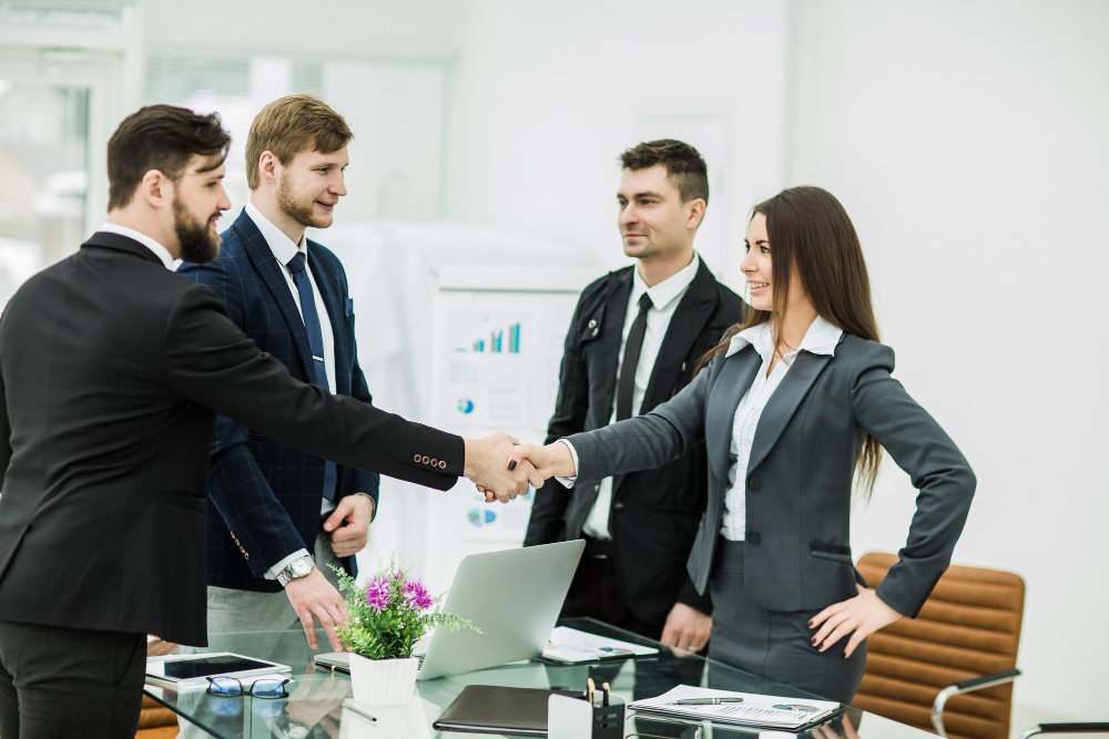 handshake-business-partners-after-signing-contract