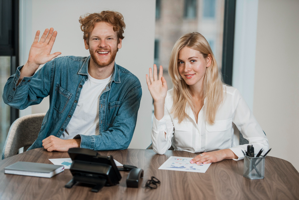 job-colleagues-waving-with-their-hands